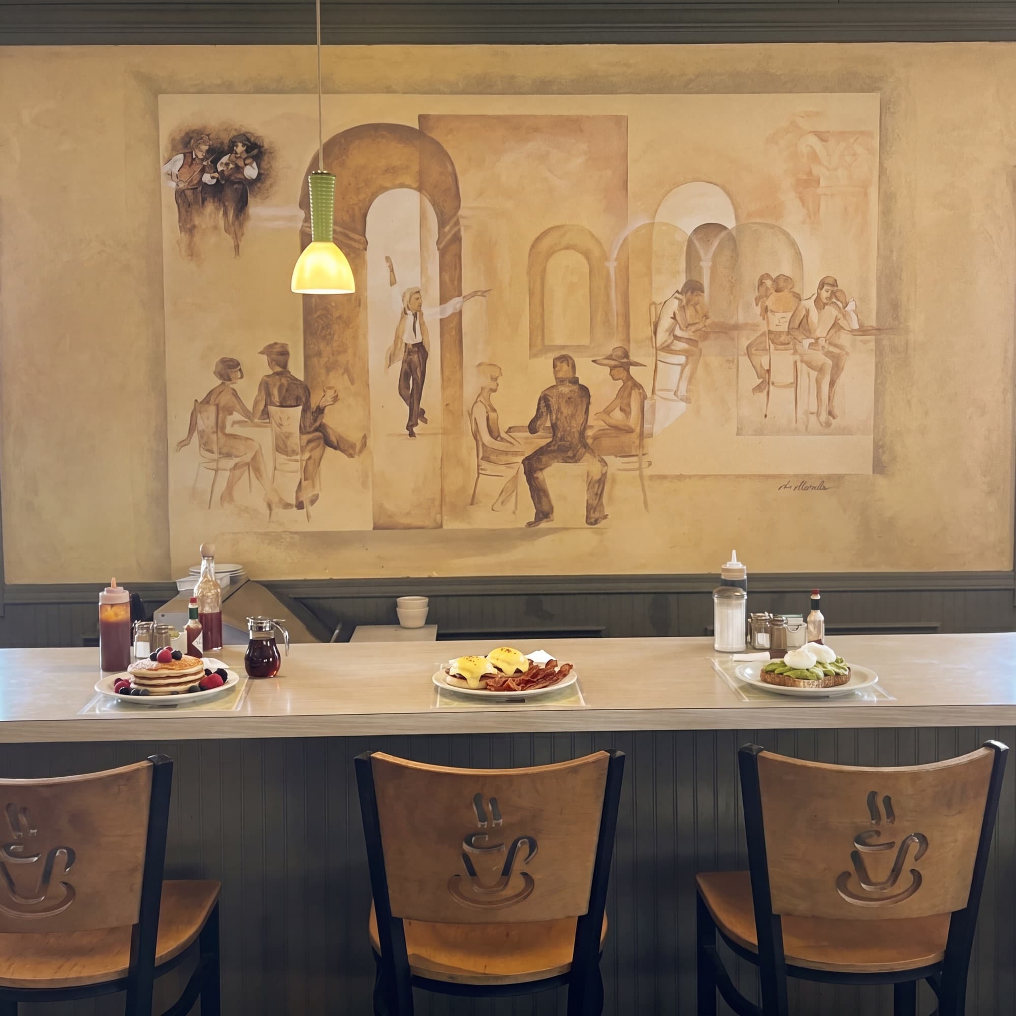 Inside Sunnyside Cafe Randolph MA — counter and dining area set for breakfast